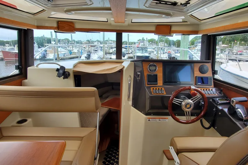 Swell Life Yacht Photos Pics Interior of 2021 Ranger Tugs R-25 boat with modern helm and seating.