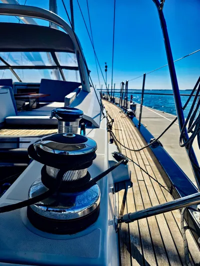 Trois Vignes Yacht Photos Pics 2015 Jeanneau Aft Cockpit sailboat with sleek deck design and ocean view.