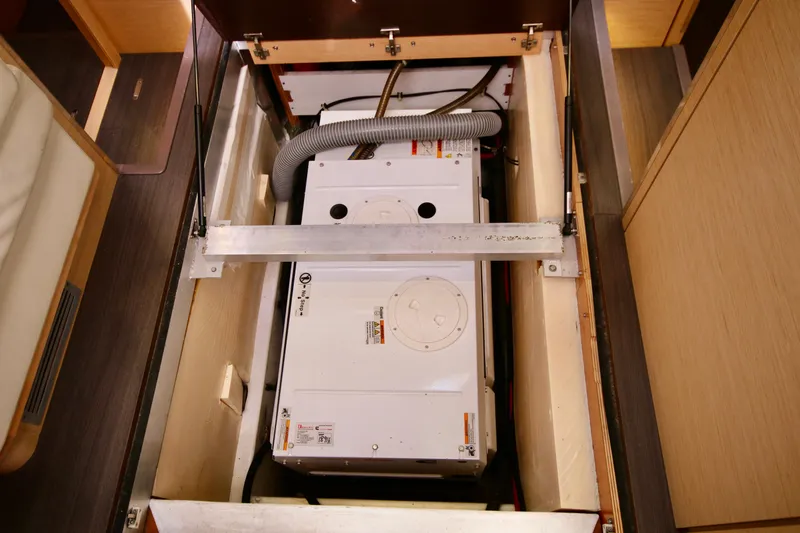 Trois Vignes Yacht Photos Pics 2015 Jeanneau Aft Cockpit engine compartment with visible machinery and hoses.