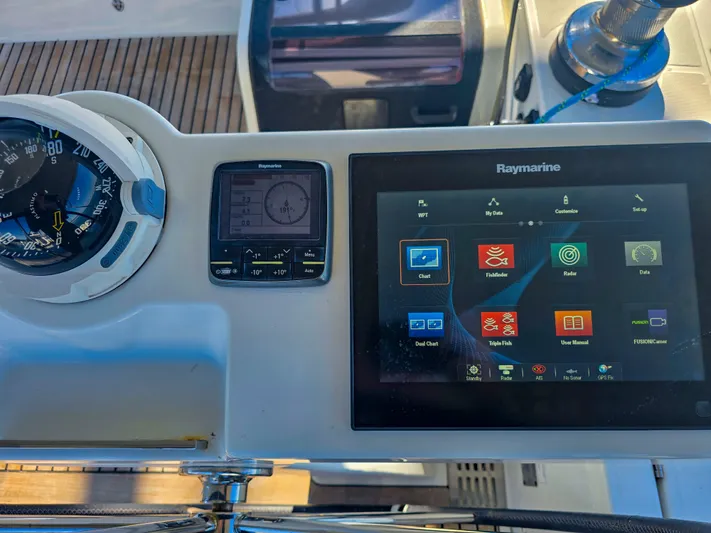 Trois Vignes Yacht Photos Pics Jeanneau Aft Cockpit 2015 with Raymarine navigation display and compass.