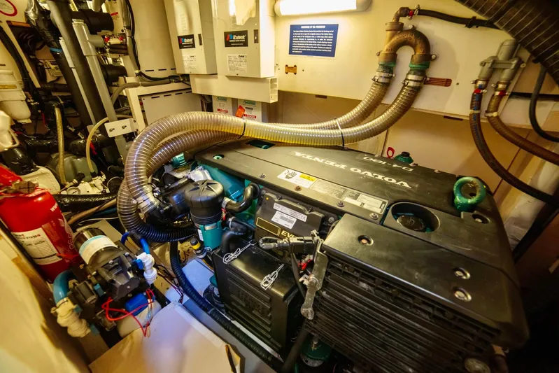 Trois Vignes Yacht Photos Pics Engine room of 2015 Jeanneau Aft Cockpit boat, featuring mechanical components and equipment.