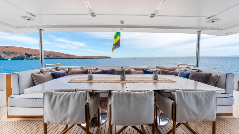  Yacht Photos Pics Luxurious 2019 Azimut Grande 35 Metri yacht deck with elegant dining area and ocean view.