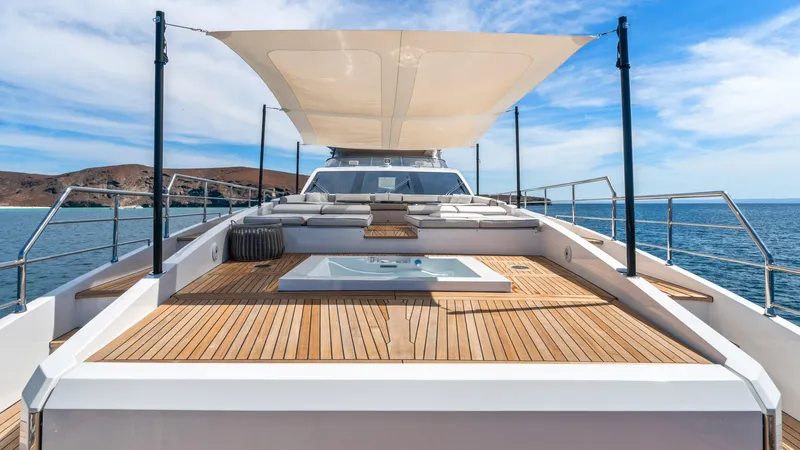 Yacht Photos Pics Luxurious 2019 Azimut Grande 35 Metri yacht deck with sunshade and ocean view.