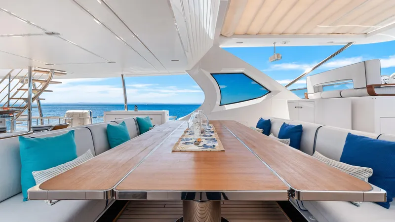  Yacht Photos Pics Luxurious 2019 Azimut Grande 35 Metri yacht deck with elegant dining area and ocean view.