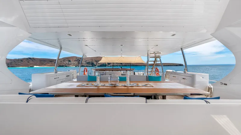  Yacht Photos Pics Luxurious Azimut Grande 35 Metri yacht deck with dining area, ocean view, and elegant design.