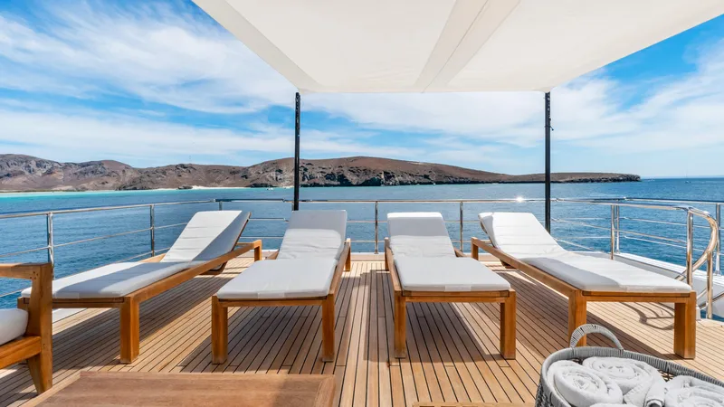  Yacht Photos Pics Luxurious deck of 2019 Azimut Grande 35 Metri yacht with sun loungers and ocean view.