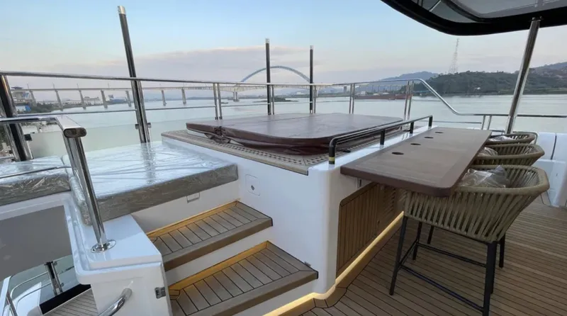  Yacht Photos Pics Luxurious deck of 2023 Heysea Asteria 142 yacht with seating and scenic views.