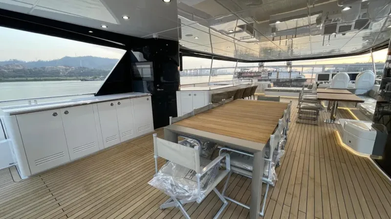  Yacht Photos Pics Luxurious Heysea Asteria 142 yacht deck with modern dining area, 2023 model.