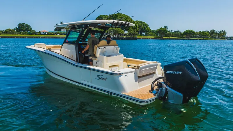 Yacht Photos Pics 2022 Scout 305 LXF boat on water with Mercury outboard engines.