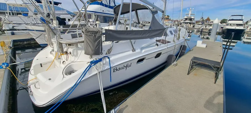 Bashful Yacht Photos Pics 2006 Hunter 46 LE sailboat docked at a marina, named Bashful.