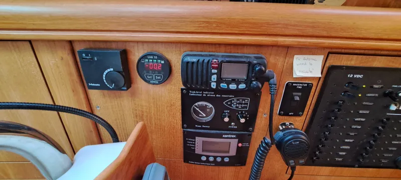 Bashful Yacht Photos Pics Control panel of a 2006 Hunter 46 LE sailboat with various instruments and gauges.