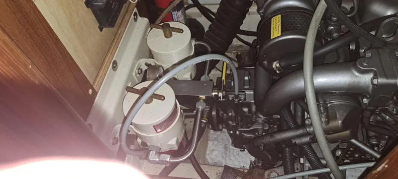Bashful Yacht Photos Pics Engine compartment of a 2006 Hunter 46 LE sailboat showing fuel filters and hoses.