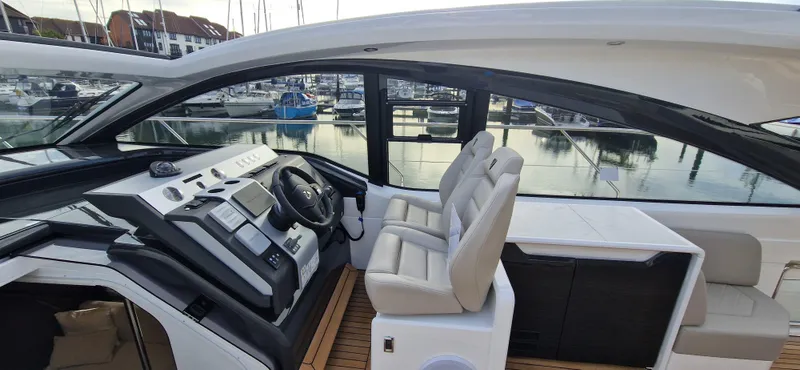 In Stock Yacht Photos Pics 2025 Fairline Targa 45 Open yacht cockpit with modern controls and seating.