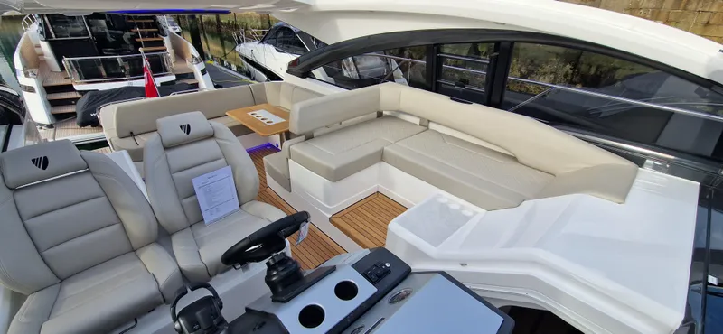 In Stock Yacht Photos Pics 2025 Fairline Targa 45 Open yacht interior with luxurious seating and modern helm.