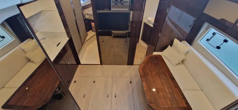 In Stock Yacht Photos Pics 2025 Fairline Targa 45 Open interior with elegant seating and wooden table.