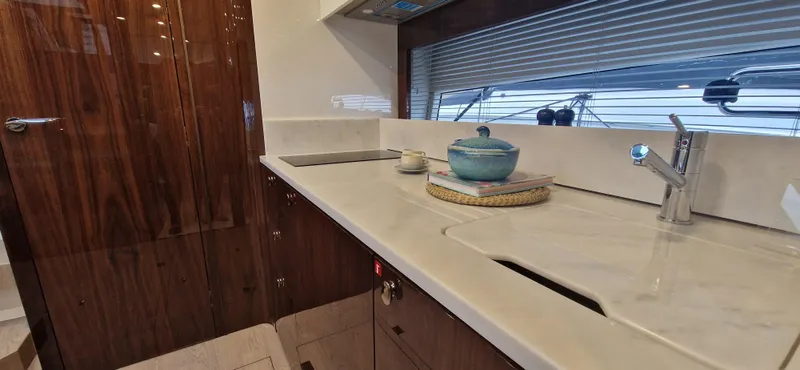 In Stock Yacht Photos Pics Luxurious kitchen interior of 2025 Fairline Targa 45 Open yacht with modern amenities.