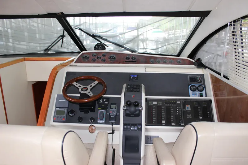  Yacht Photos Pics 2006 Fairline Phantom yacht helm with modern navigation controls and leather seats.