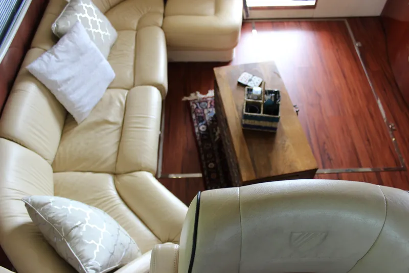  Yacht Photos Pics Luxurious interior of a 2006 Fairline Phantom yacht with leather seating and wooden table.