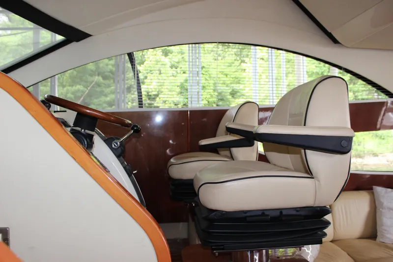  Yacht Photos Pics Interior helm of 2006 Fairline Phantom yacht with leather captain chairs.
