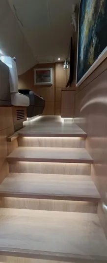 Feel So Good Yacht Photos Pics Interior staircase of 2021 Privilege 640 yacht with modern wooden design.