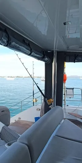 Feel So Good Yacht Photos Pics Luxury Privilege 640 yacht interior with fishing rod, 2021 model, on calm waters.