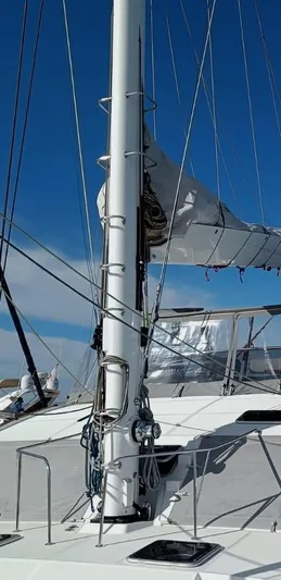 Feel So Good Yacht Photos Pics Sailing yacht Privilege 640, 2021 model, with mast and rigging against clear blue sky.