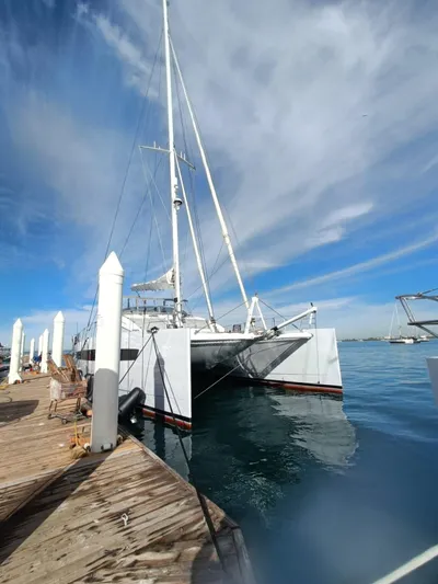 Feel So Good Yacht Photos Pics Luxury Privilege 640 catamaran docked at marina, clear blue sky, 2021 model.