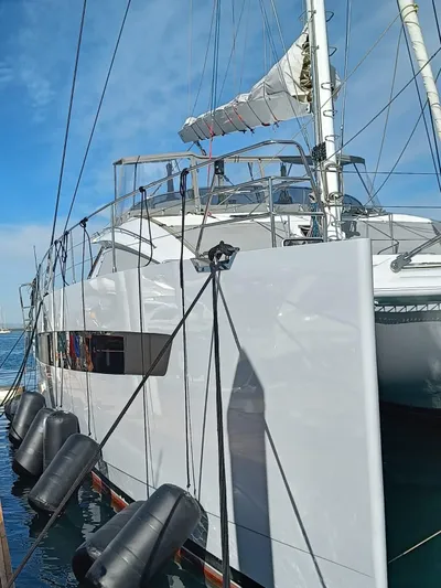 Feel So Good Yacht Photos Pics Luxury Privilege 640 catamaran yacht docked, showcasing sleek design and modern features, 2021 model.