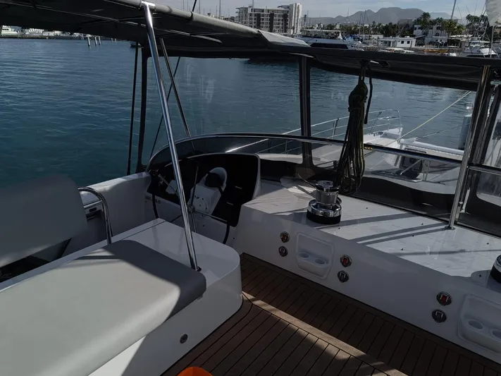 Feel So Good Yacht Photos Pics Cockpit of 2021 Privilege 640 yacht with modern seating and ocean view.