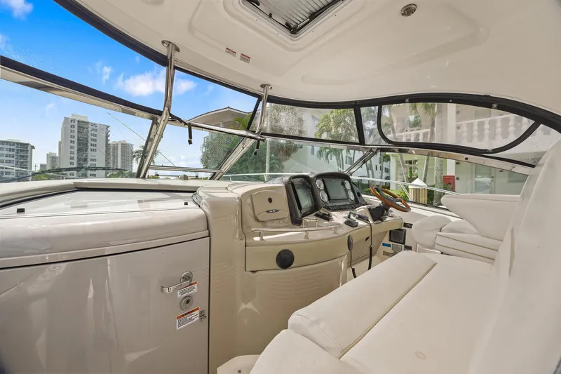  Yacht Photos Pics 2008 Sea Ray 44 Sundancer helm with modern controls and cityscape view.