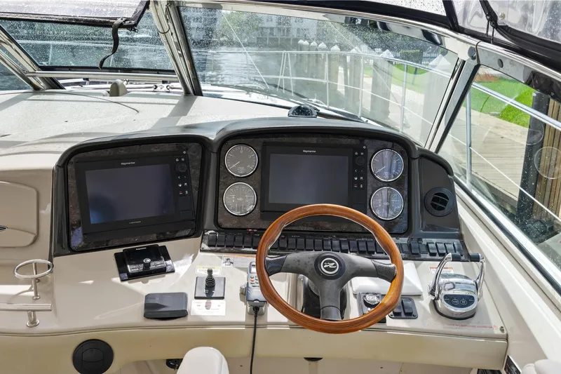  Yacht Photos Pics 2008 Sea Ray 44 Sundancer helm with dual displays and wooden steering wheel.