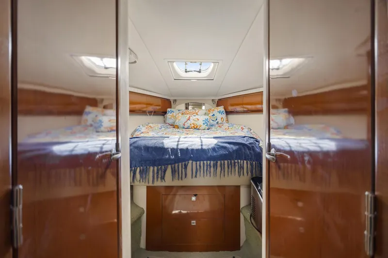  Yacht Photos Pics Luxurious cabin interior of 2008 Sea Ray 44 Sundancer yacht with cozy bedding.