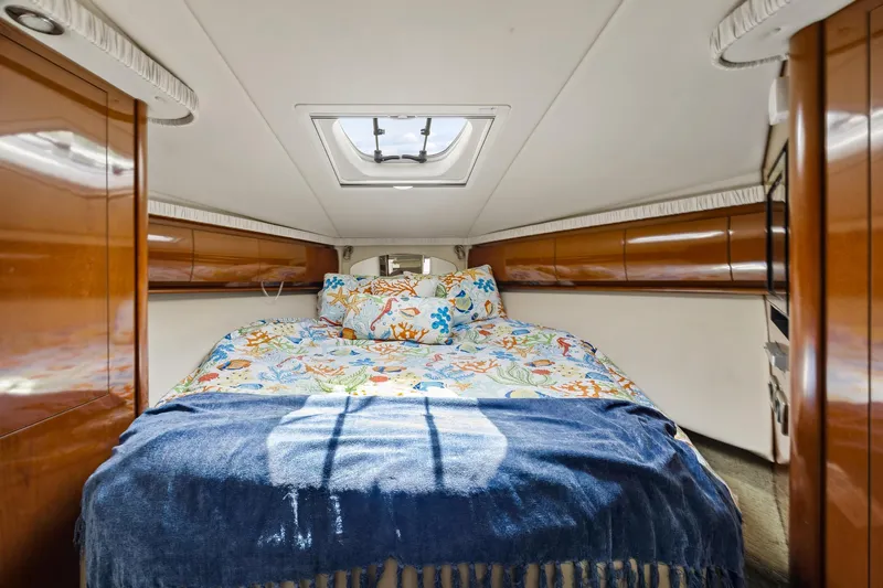  Yacht Photos Pics Luxurious cabin interior of 2008 Sea Ray 44 Sundancer yacht with colorful bedding.