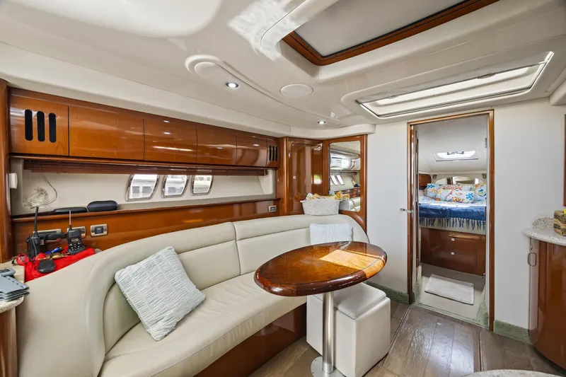  Yacht Photos Pics Luxurious interior of 2008 Sea Ray 44 Sundancer yacht with elegant seating and wood finishes.