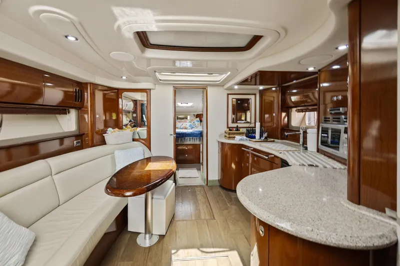  Yacht Photos Pics Luxurious interior of 2008 Sea Ray 44 Sundancer yacht with elegant wood finishes.