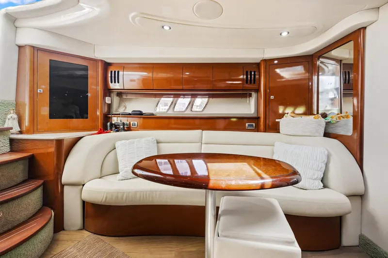  Yacht Photos Pics Luxurious interior of 2008 Sea Ray 44 Sundancer yacht with elegant seating and wooden table.