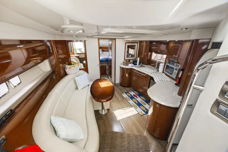  Yacht Photos Pics Luxurious interior of 2008 Sea Ray 44 Sundancer yacht with modern kitchen and seating area.
