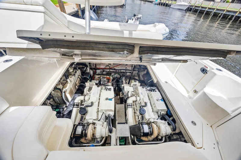  Yacht Photos Pics Engine compartment of 2008 Sea Ray 44 Sundancer yacht, showcasing dual engines by the water.