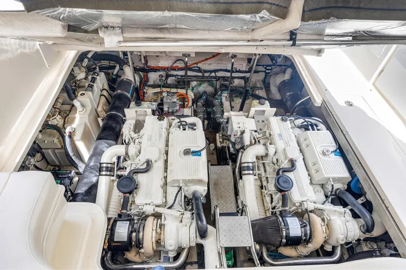  Yacht Photos Pics Engine room of 2008 Sea Ray 44 Sundancer yacht, showcasing dual engines and mechanical components.