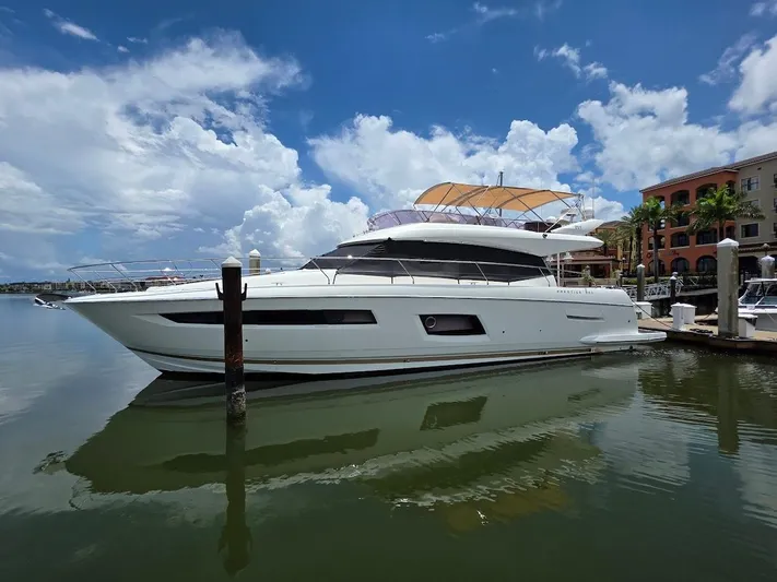Just Peachy Yacht Photos Pics 2015 Prestige 550 Fly yacht docked in a sunny marina.