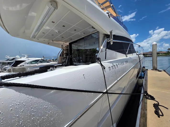 Just Peachy Yacht Photos Pics Luxury 2015 Prestige 550 Fly yacht docked under clear blue sky.