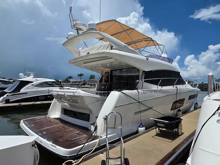 Just Peachy Yacht Photos Pics Luxury 2015 Prestige 550 Fly yacht docked at marina under clear sky.