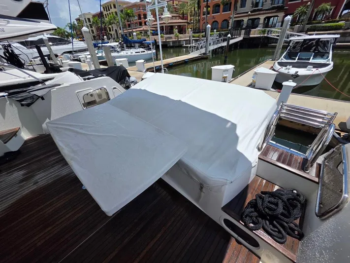 Just Peachy Yacht Photos Pics 2015 Prestige 550 Fly yacht docked at marina with covered seating area.
