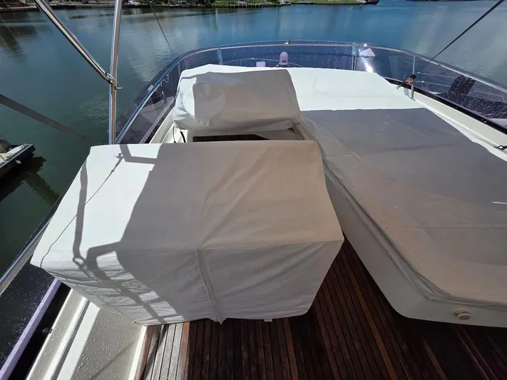 Just Peachy Yacht Photos Pics Flybridge of 2015 Prestige 550 Fly yacht with covered seating area.