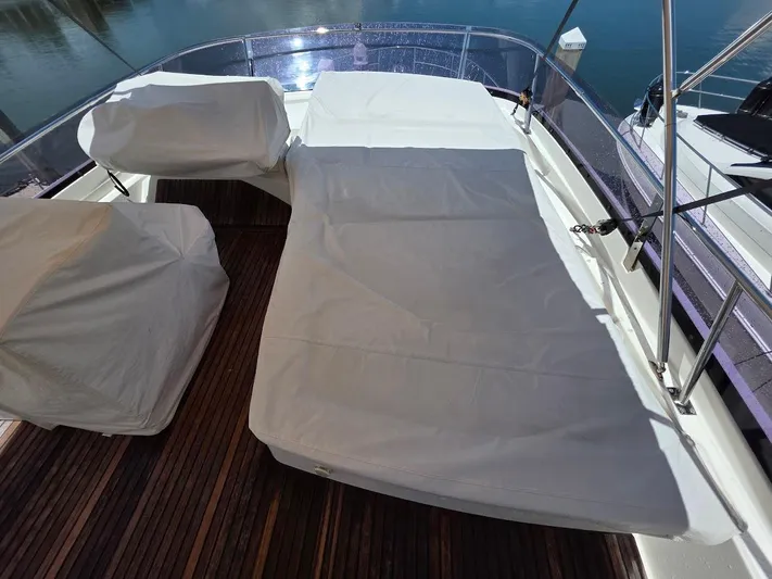 Just Peachy Yacht Photos Pics Covered seating area on 2015 Prestige 550 Fly yacht deck.