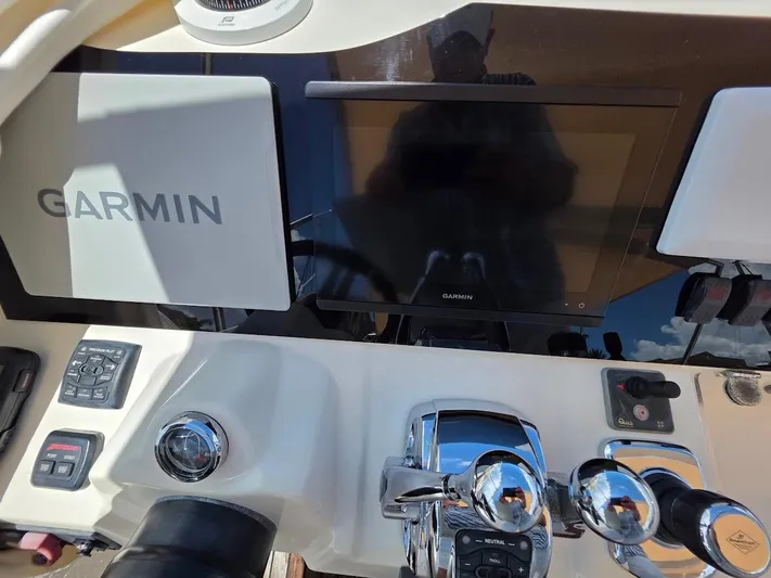 Just Peachy Yacht Photos Pics Control panel of 2015 Prestige 550 Fly yacht with Garmin navigation system.