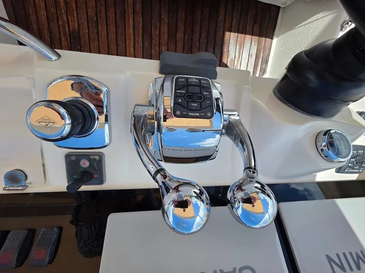 Just Peachy Yacht Photos Pics Control panel of a 2015 Prestige 550 Fly yacht with chrome throttle levers.