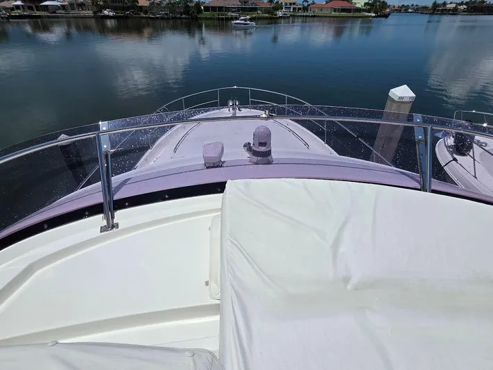 Just Peachy Yacht Photos Pics 2015 Prestige 550 Fly yacht bow view on calm water.