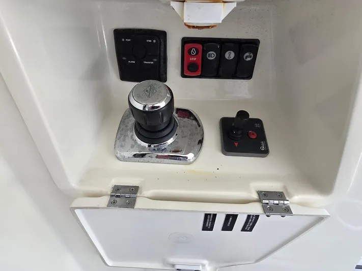 Just Peachy Yacht Photos Pics Control panel of a 2015 Prestige 550 Fly yacht with joystick and switches.