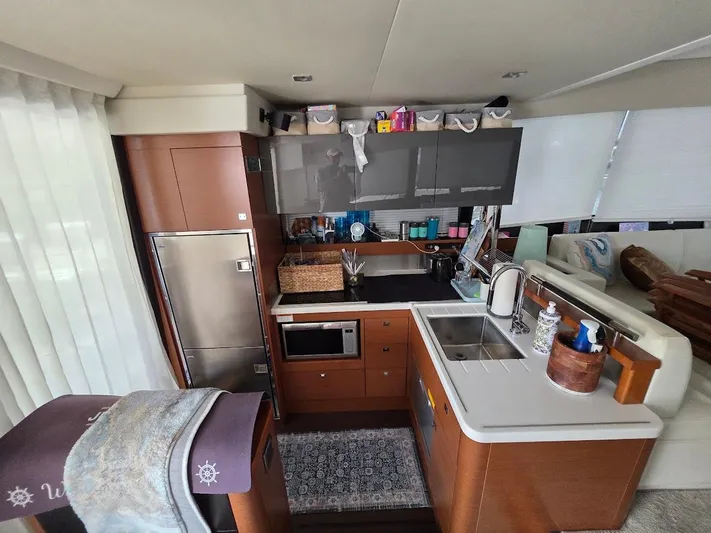 Just Peachy Yacht Photos Pics Luxurious kitchen interior of a 2015 Prestige 550 Fly yacht, featuring modern appliances and elegant design.